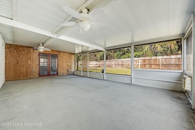 unfurnished sunroom featuring ceiling fan