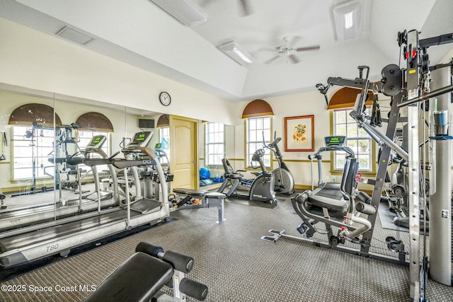 gym with ceiling fan and lofted ceiling