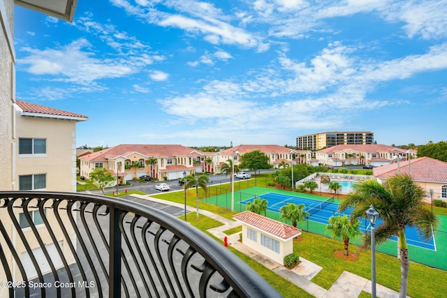 balcony featuring tennis court