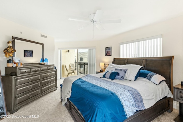 carpeted bedroom with access to exterior and ceiling fan