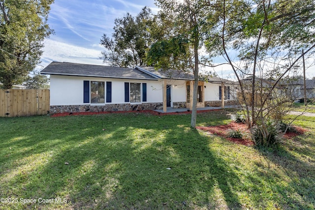 ranch-style house featuring a front lawn