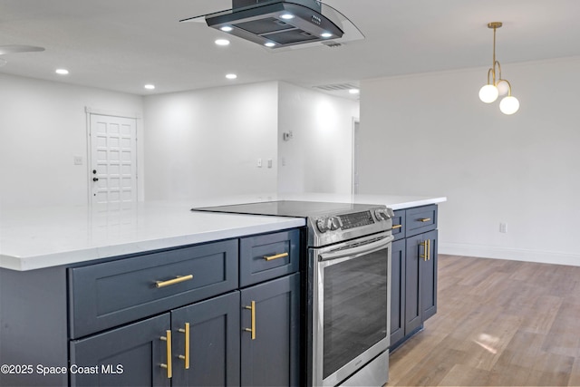 kitchen with hanging light fixtures, light wood-type flooring, and stainless steel range with electric stovetop