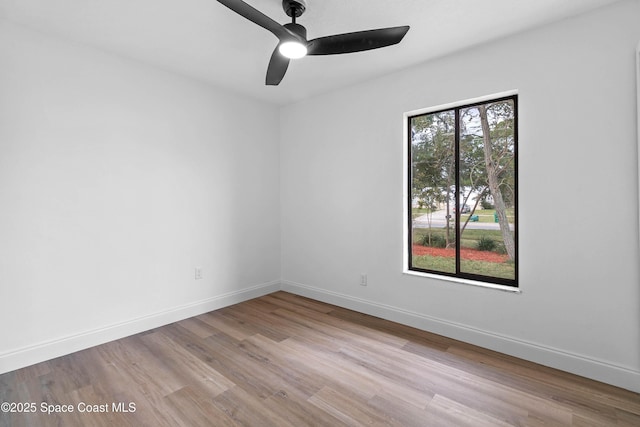 empty room featuring light hardwood / wood-style floors and ceiling fan