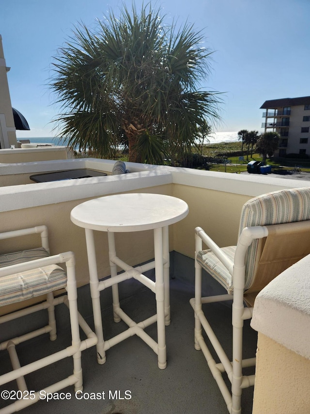 balcony featuring a water view