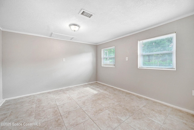 spare room with light tile patterned flooring and ornamental molding