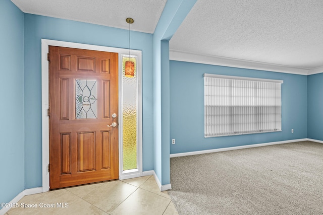 foyer entrance featuring light tile patterned floors