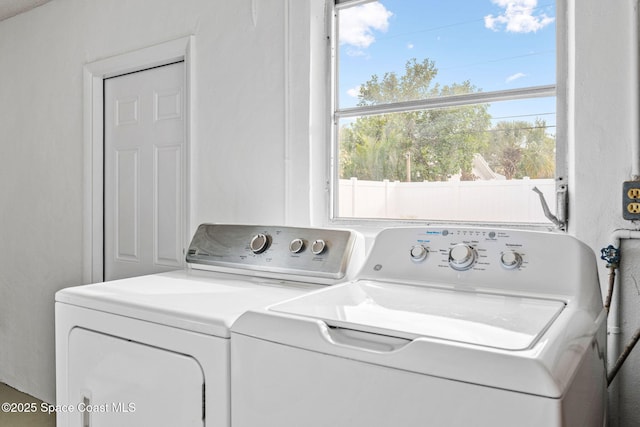 clothes washing area featuring washing machine and dryer