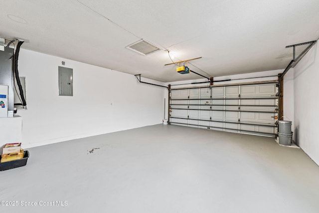 garage featuring a garage door opener and electric panel