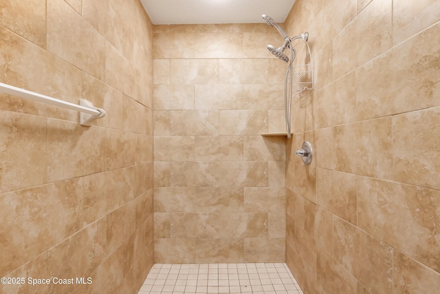 bathroom featuring tiled shower