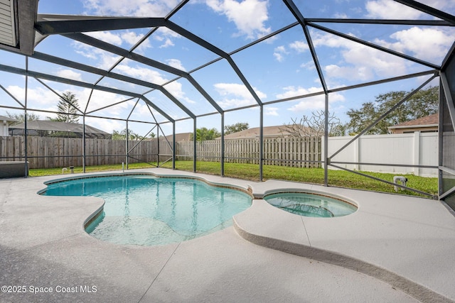 view of swimming pool with an in ground hot tub, a patio area, and glass enclosure