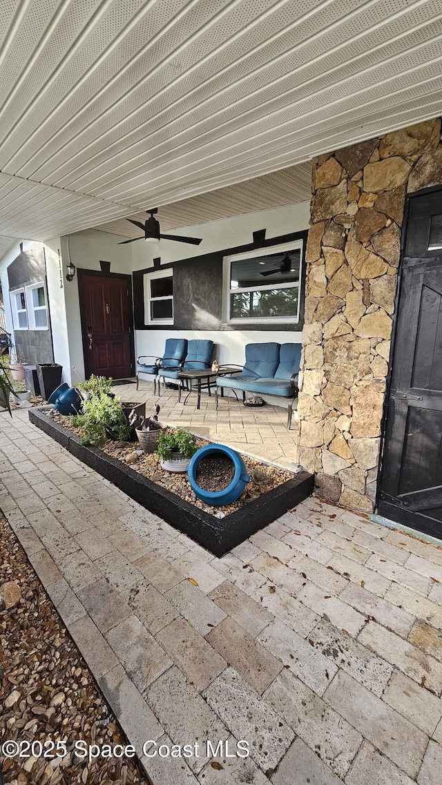 view of patio / terrace featuring ceiling fan