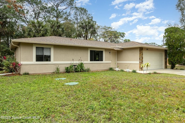 ranch-style house featuring a garage and a front lawn