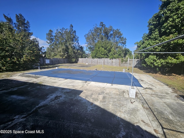 view of pool featuring a patio and a fenced backyard