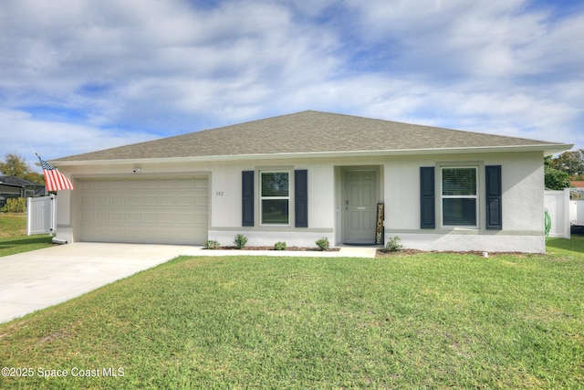 ranch-style home with a front yard and a garage