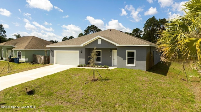 ranch-style house featuring a garage and a front lawn