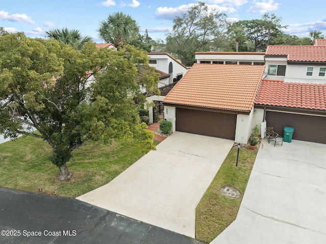 view of front of house with a front yard and a garage