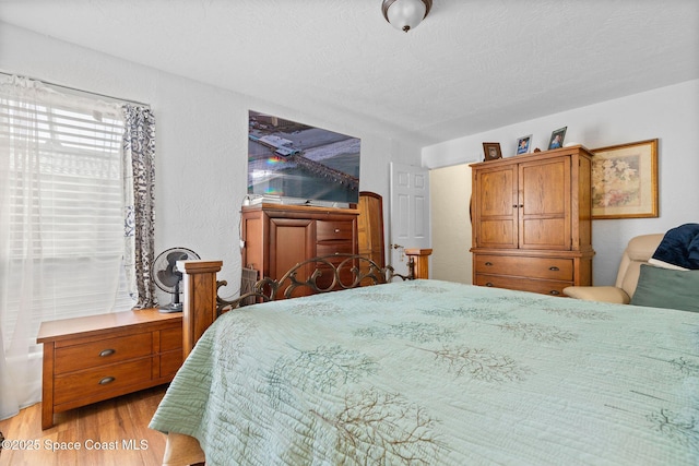 bedroom featuring light wood-type flooring