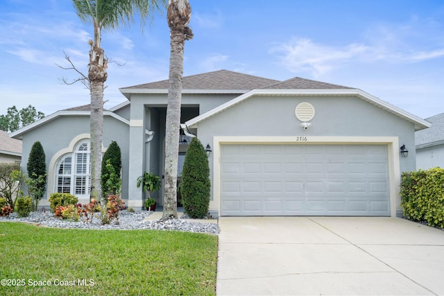 single story home with a garage and a front yard