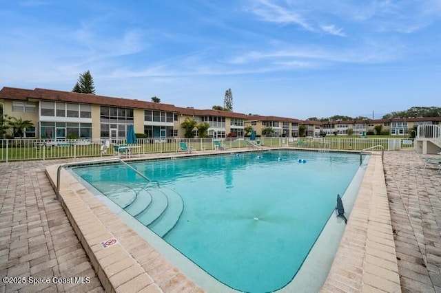 view of swimming pool with a patio area