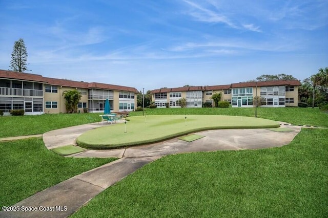 view of home's community with a lawn