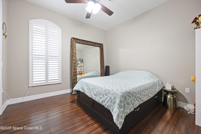 bedroom featuring dark wood-type flooring and ceiling fan