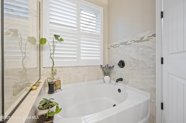 bathroom featuring a bath