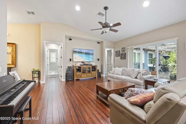 living room featuring lofted ceiling, dark hardwood / wood-style floors, and ceiling fan