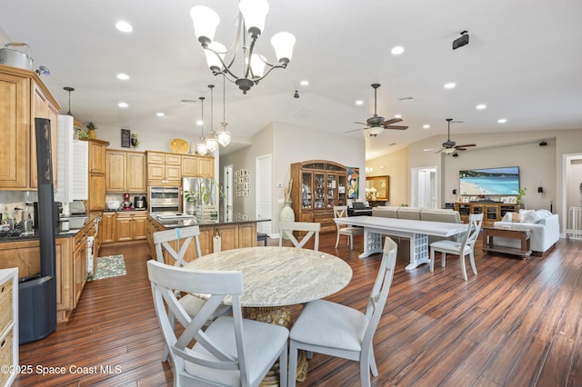 dining area with lofted ceiling, a notable chandelier, and dark wood-type flooring