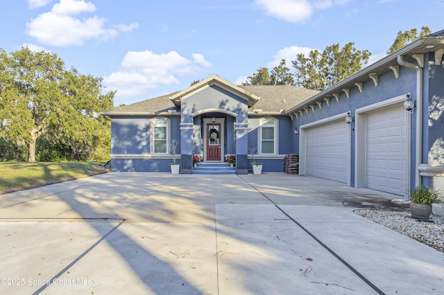 single story home with a garage