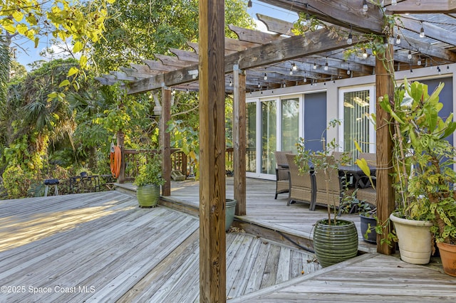 wooden terrace featuring a pergola