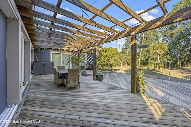 wooden deck featuring a pergola