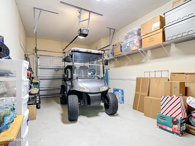 garage featuring a garage door opener