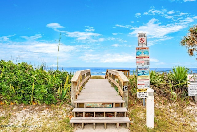 surrounding community featuring a water view