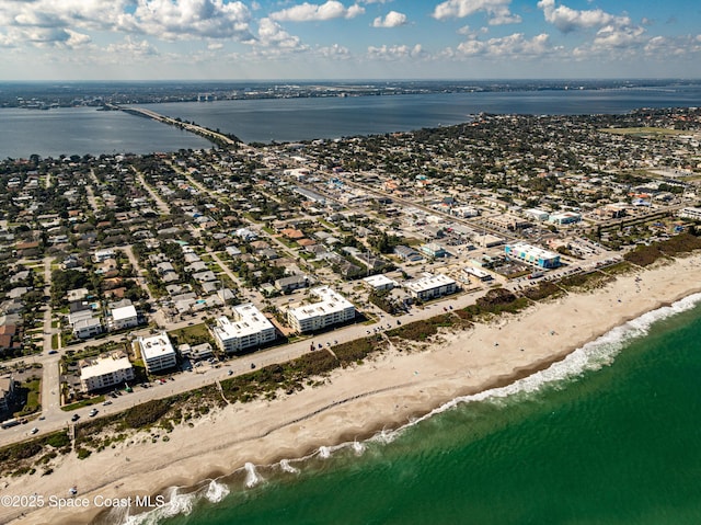 aerial view with a water view and a view of the beach