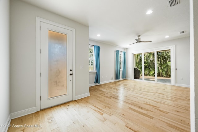 interior space featuring ceiling fan and light wood-type flooring