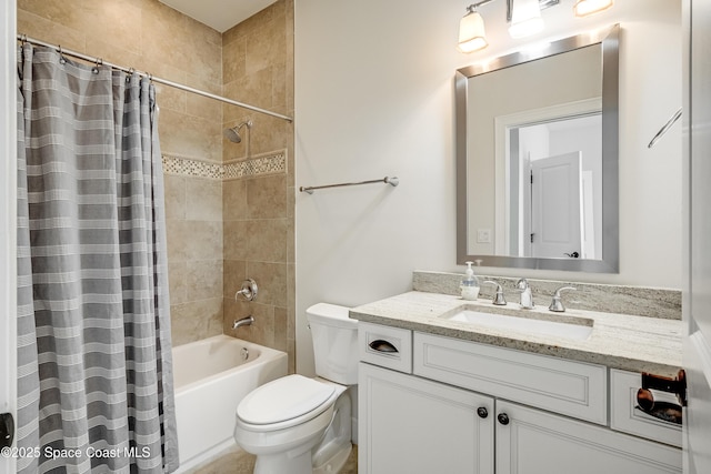 full bathroom with vanity, shower / bath combination with curtain, and toilet