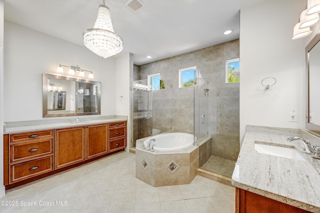 bathroom featuring tile patterned floors, shower with separate bathtub, a chandelier, and vanity