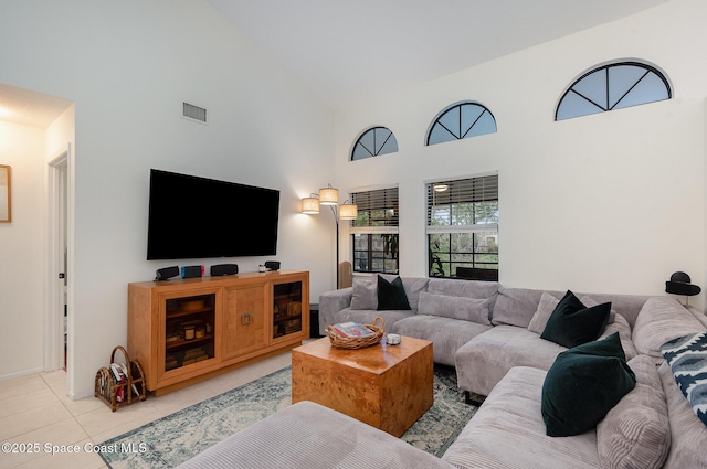 tiled living room with a high ceiling