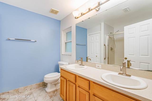 bathroom featuring walk in shower, vanity, toilet, and tile patterned flooring