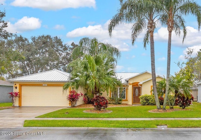 ranch-style house with a garage and a front lawn