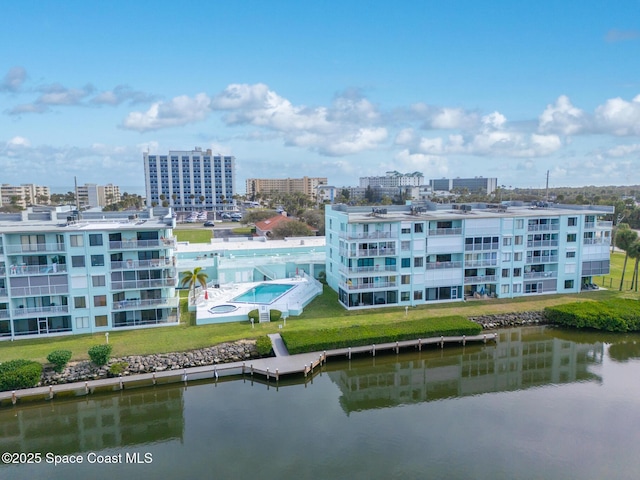 birds eye view of property with a water view