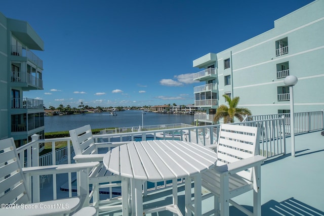 balcony featuring a water view