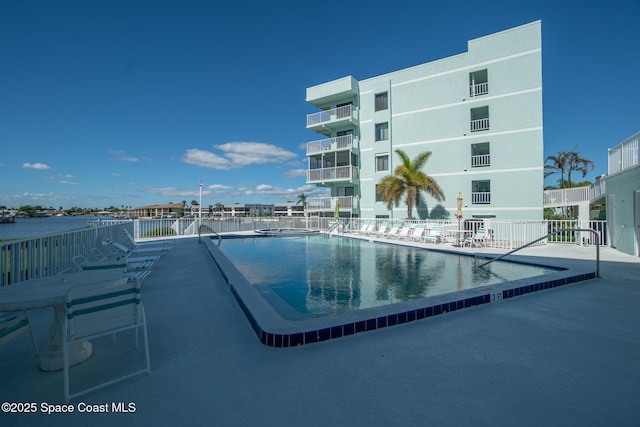 view of swimming pool with a patio