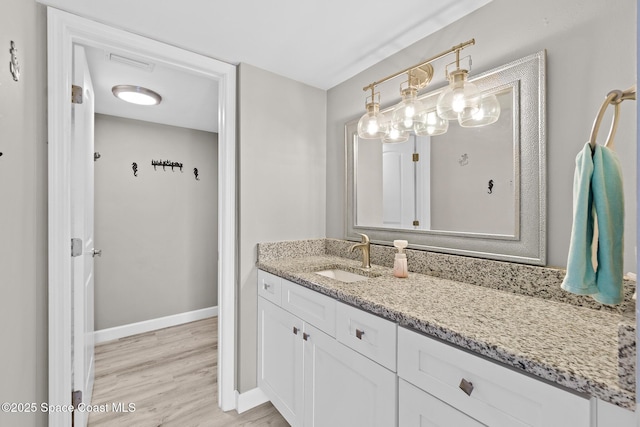 bathroom featuring vanity and hardwood / wood-style floors