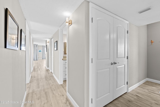 hallway featuring light wood-type flooring