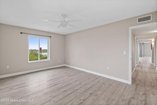 spare room with ceiling fan and light hardwood / wood-style floors