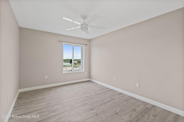 spare room with ceiling fan and light hardwood / wood-style floors