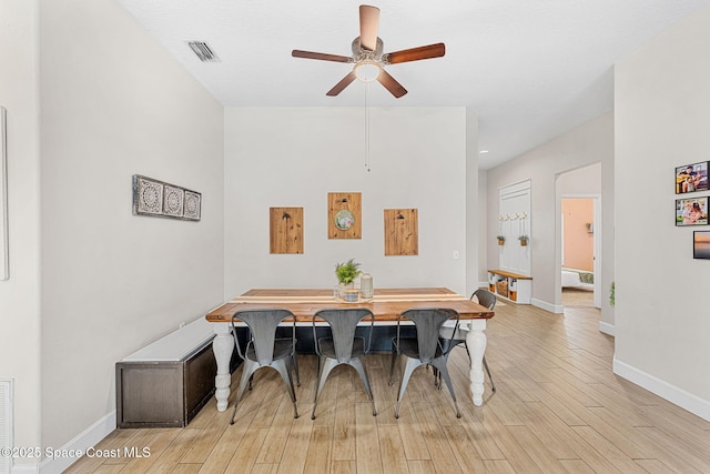 dining space featuring ceiling fan and light hardwood / wood-style flooring