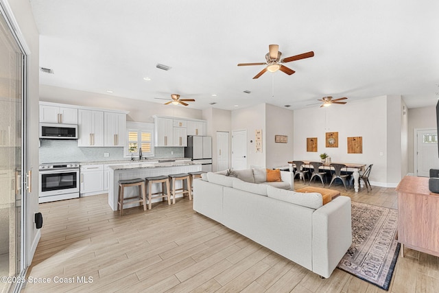 living room with light hardwood / wood-style floors