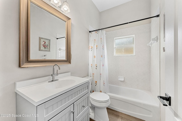 full bathroom featuring toilet, vanity, and shower / bath combination with curtain